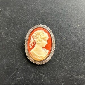 Vintage Cameo Brooch Orange And Silver Scalloped Edge. Weighs .2 ounces